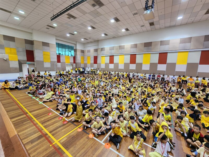 Primary schools students are all decked in yellow during their assembly as they raise fund for Children's Cancer Association Malaysia