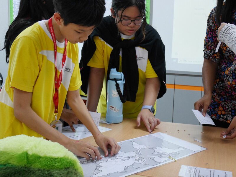 Secondary school students solving a quiz during Humanities Week