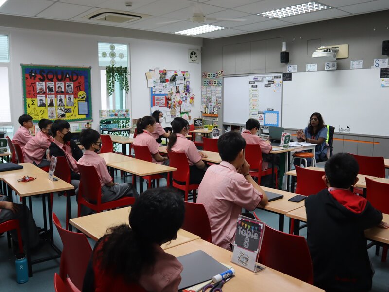 Secondary School students receiving 1st day of school briefing from their teacher