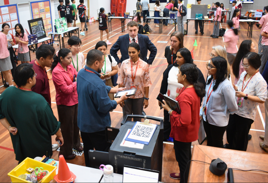 Judges evaluate student sustainability projects at Taylor's International School Puchong Secondary STEAM Fair.