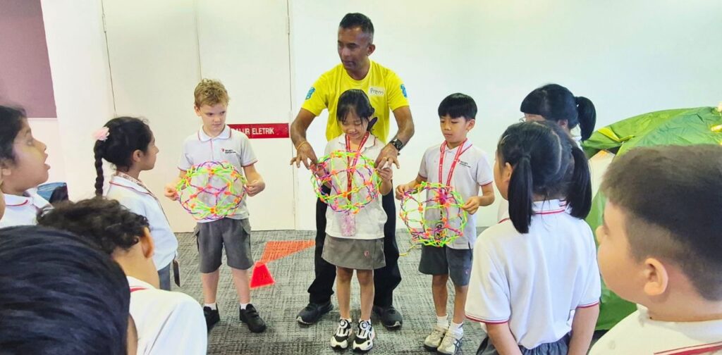 TISKL Primary students participating in a sensory activity during Diversity Week.