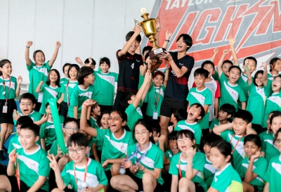 Students from Green House celebrate after being crowned Key Stage 2 champions at Sports Day at Taylor's International School Puchong, proudly lifting the championship trophy.